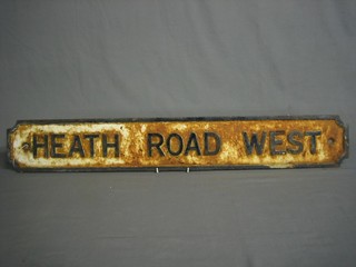 A metal road sign - Heath Road West
