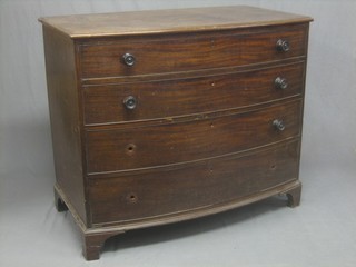 A 19th Century mahogany bow front chest of 4 long drawers with tore handles, raised on bracket feet 45"
