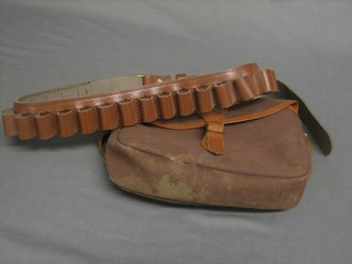 A canvas cartridge bag together with a leather Barbour cartridge belt