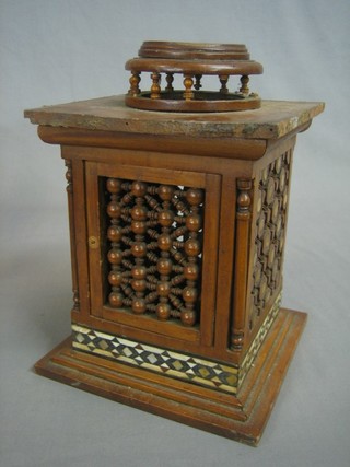A square Moorish cabinet enclosed by a panelled door 7"