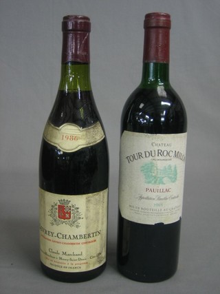 A bottle of 1986 Gevrey-Chambertin together with a bottle of 1985 Chateau Tour Du Roc Milon Pauillac
