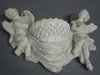 A "plaster" garden wall pocket supported by 2 cherubs 17 1/22