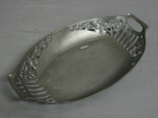 An Art Nouveau boat shaped Continental pierced pewter dish, base marked AOG 3147 10"