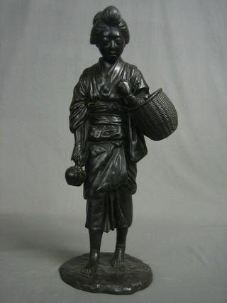 A Japanese bronze figure of a standing lady with basket, the base with 3 character signature 20"