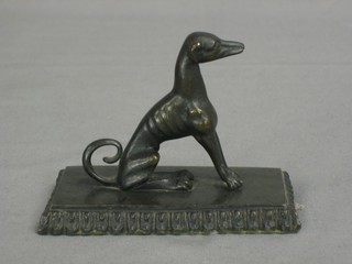 A 19th Century bronze paperweight in the form of a seated greyhound 4"
