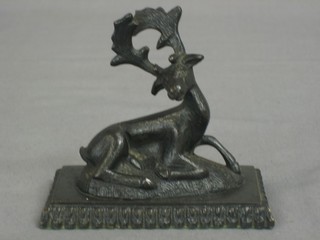 A 19th Century bronze paperweight in the form of a reclining stag 4"