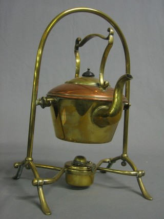 A Victorian copper and brass spirit kettle complete with burner