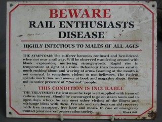 A humerous enamelled sign - Beware Rail Enthusiasts 7" x 9"