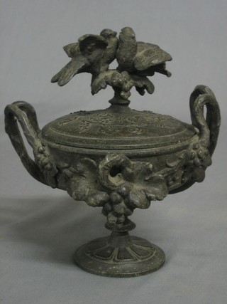A circular 19th Century spelter twin handled urn and cover 6"