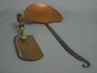 A 19th Century planished copper crumb scoop, the reverse marked TH with turned wooden handle together with a copper and iron handled chestnut roaster
