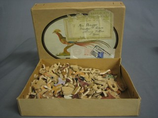 A child's wooden jigsaw puzzle in the form of a fabulous bird