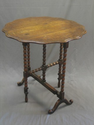 An oak oval folding coaching table 28"