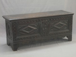 An 18th Century carved oak coffer of plant construction with hinged lid 47"