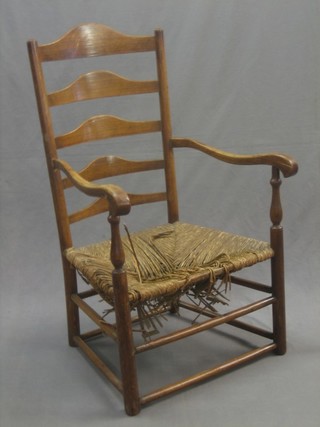 An elm ladder back carver chair with woven rush seat