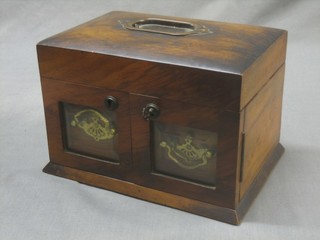 A Victorian walnut jewellery box with hinged lid, the interior fitted a drawer enclosed by a pair of panelled doors 8"