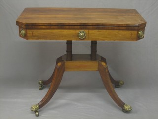 A 19th Century lozenge shaped inlaid rosewood card table raised on 4 columns with a platform base ending in splayed feet 35"
