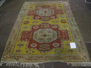 An Eastern yellow ground rug with 2 octagons to the centre within multi-row borders 75" x 50"