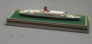 A Minic model of the QEII no. 921, cased