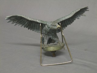 A metal car mascot in the form of an Eagle with wings outstretched 10"