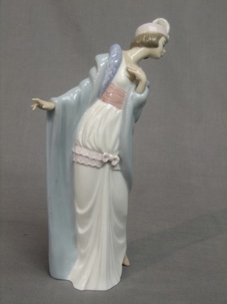 A Lladro figure of a standing Flapper Girl, base marked 5789 9" 