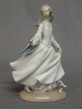 A Lladro figure of a standing walking lady - Cinderella, base marked 4828 10"