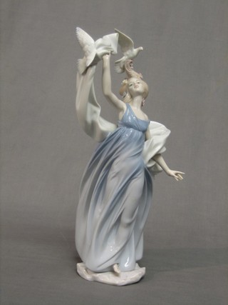 A Lladro figure of a standing lady with birds - Inspiration Millennium 1999, base marked 6570 14"