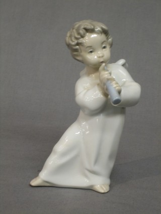 A Lladro figure of an Angel playing a recorder 6"