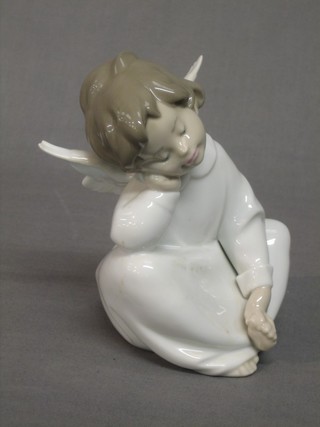 A Lladro figure of a seated Angel 5"
