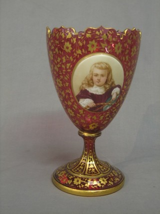 A 19th Century Bohemian red and gold glass chalice shaped vase with oval enamelled plaque decorated a portrait of a girl 11"