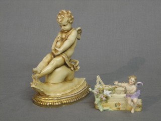 A 19th Century Continental porcelain figure of a Cherub riding a snail 5", together with a biscuit porcelain figure of a cherub sat by a fence 2"