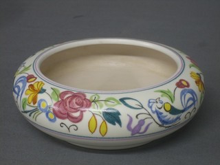 A circular Poole Pottery bowl with floral decoration, base incised E/Le 6"