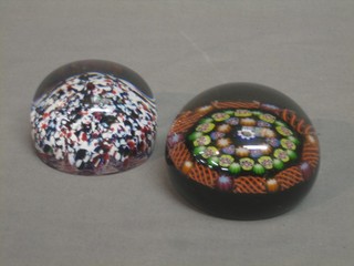 2 circular glass paperweights 3"