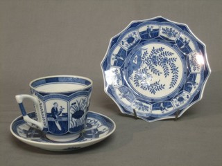 An octagonal Oriental porcelain plate the reverse with seal mark 7" together with a matching cup and saucer