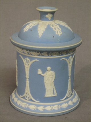 A 19th/20th Century blue jasperware cylindrical jar and cover decorated classical figures 6 1/2"
