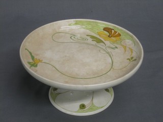 A circular Gouda Art Nouveau pottery tazza with floral decoration, the base marked Zuig Holland Gouda (some crackling) 8"