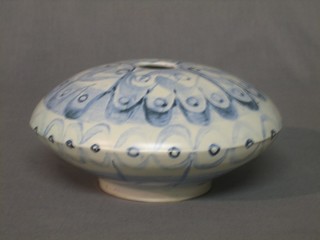 A circular Art Pottery vase with blue glazed decoration, base incised HCS 5/72 7"