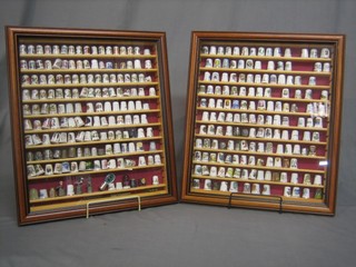 A good collection of approx. 310 thimbles contained in 2 glazed mahogany cases 17" x 19"