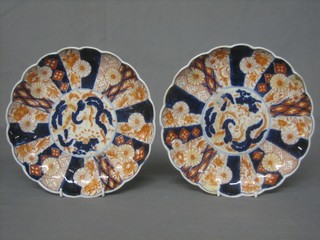 A pair of circular 19th Century Japanese Imari porcelain plates with panel decoration 9"