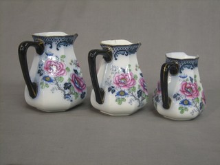 A set of 3 Losolware graduated pottery jugs