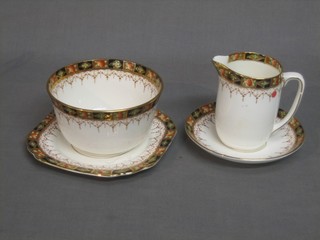 A 21 piece Gladstone china Derby style tea service comprising 9" twin handled bread plate, 6 tea plates 6" (1f), 6 cups (2f), 6 saucers, cream jug and sugar bowl