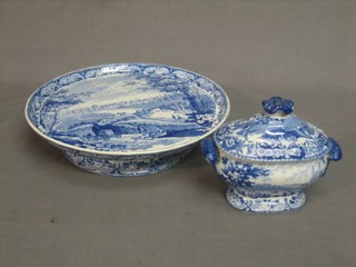 A 19th Century circular blue and white comport decorated a scene of Dublin (chip to base) 12" together with a blue and white twin handled tureen with associated lid decorated  Cambridge 7"