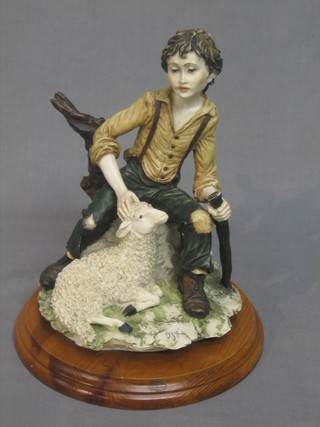 A Capo di Monte style figure of a seated shepherd 11"