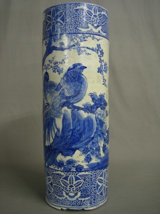An Oriental blue and white pattern cylindrical stick stand 24" (f and r)