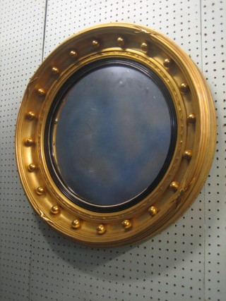 A Regency circular convex plate mirror contained in a ball studded frame 22"
