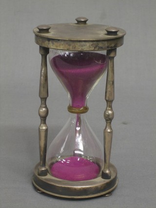 A silver plated 5 minute egg timer, the base marked Christofle France