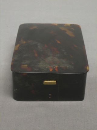 A rectangular tortoiseshell box with hinged lid and having silver gilt hinges 5 1/2"