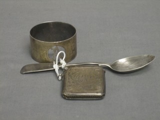 An Edwardian engraved silver vesta case Birmingham 1909, an engraved napkin ring and a Victorian fiddle pattern spoon