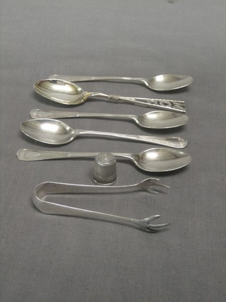 A silver thimble, a pair of silver tongs, 5 various silver teaspoons 3 ozs