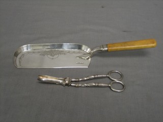 A silver plated crumb scoop and a pair of silver plated grape scissors