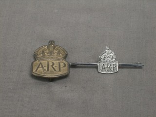 A silver ARP badge and an ARP Sweetheart badge